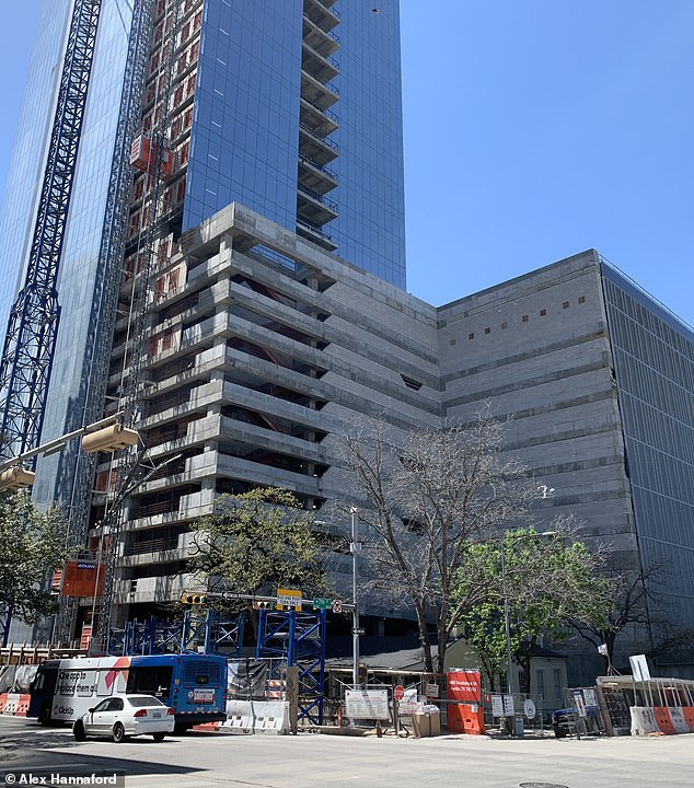 This photo of the Old BJ Smith Property standing in the shadow of the office buildings reflects Austin's growing pains, Hannaford says.