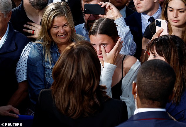 A woman wipes away tears as she comes face to face with the vice president during an emotional moment on the campaign trail