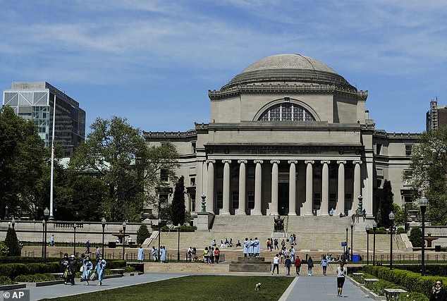 Students walk in front of the Columbia University library (photo). A professor from Columbia discussed the problems their students were having with reading