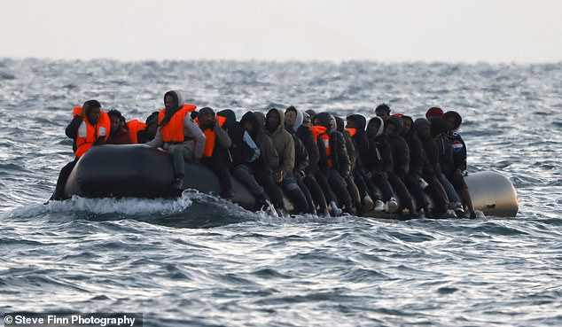 A group of up to fifty migrants were seen making the journey in a large rubber boat across the English Channel