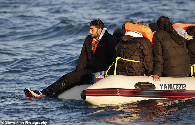 Several of those on board had life jackets - and one even dangled his feet in the water as he relaxed