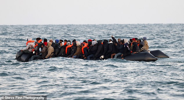 Another group of up to 50 migrants in a larger boat crosses the Channel and sets sail for Britain