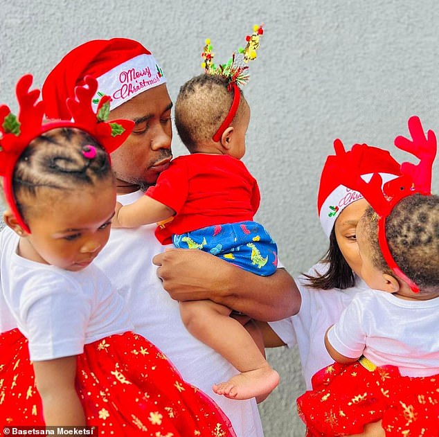 The couple said they weren't trying to have more babies, but 'babies just arrived' - pictured in a family photo