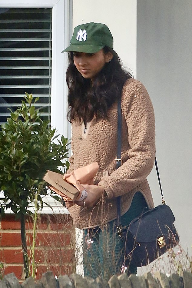 Katie also looked daunted as she donned green gym leggings and a fluffy teddy coat for the outing