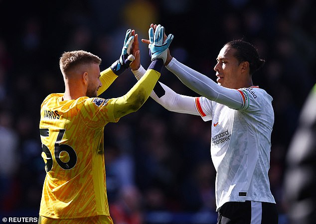 Liverpool skipper Virgil van Dijk celebrates with the goalkeeper after the clean sheet