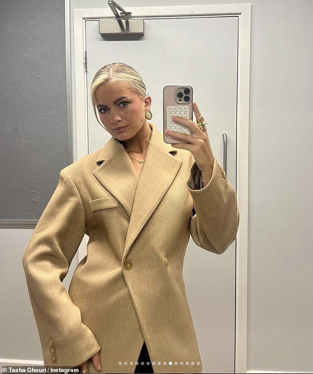 The beauty also cut an effortlessly chic figure in a structured beige blazer as she posed for a glamorous mirror selfie