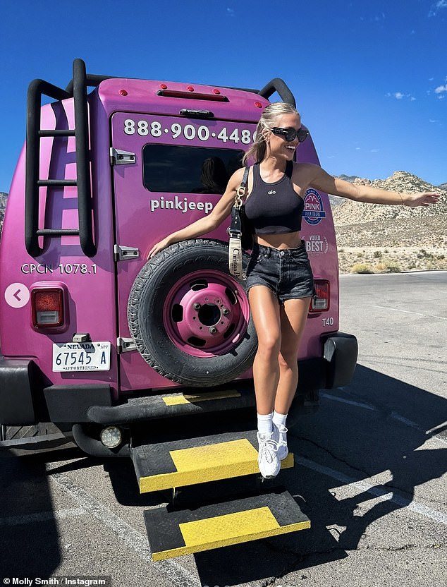 Posing up a storm on a pink Jeep, Molly looked in good spirits as she styled her blonde locks in a half-up, half-down hairstyle and wore some cool black shades.