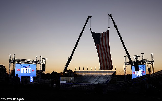 The sun rises behind the stage ahead of a campaign rally for Republican presidential candidate, former US President Donald Trump, at the Butler Farm Show Inc. on October 5, 2024 in Butler, Pennsylvania