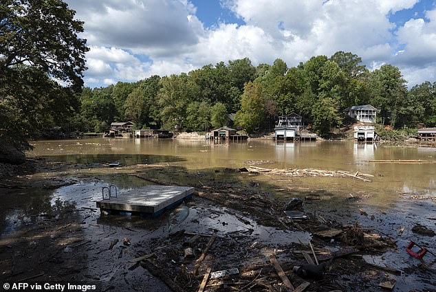 Milton is expected to bring an intimidating 12 inches of rain that could inundate the already struggling region of Florida, with many still recovering from intense flooding and winds of more than 140 miles per hour. Pictured: Pieces of a destroyed dock are seen in Lake Lure, North Carolina on October 2