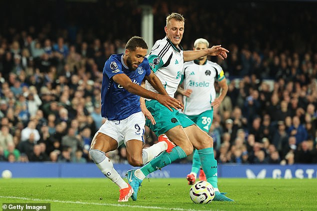 Dominic Calvert-Lewin (left) was denied a penalty after coming under pressure from Dan Burn