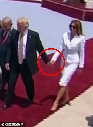 At the time, video showed Melania clearly swatting Trump's hand away as she walked half a step behind him and Israeli Prime Minister Benjamin Netanyahu and his wife Sara.