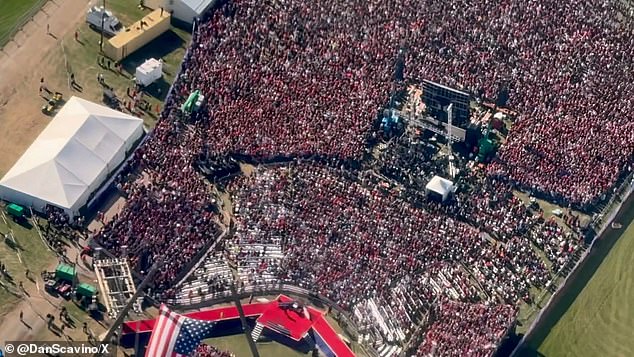 The video showed crowds dressed in pro-Trump merchandise gathering around a stage as an American flag waved in the air