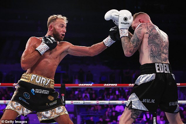 Tyson watched cousin Walter Fury (left) defeat Dale Arrowsmith (right) on the undercard