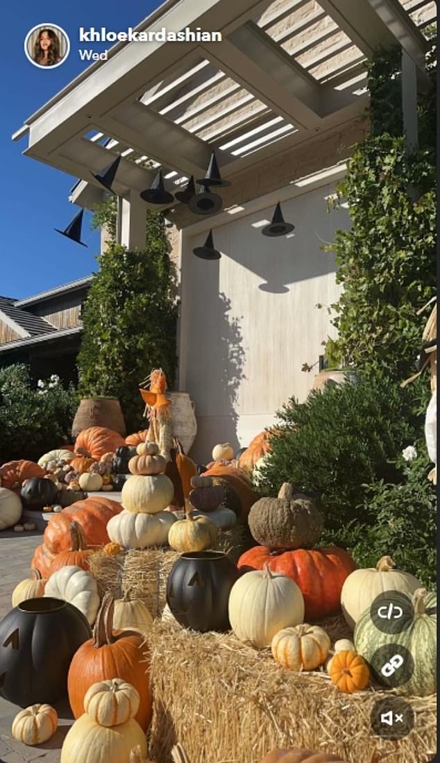 Multicolored and large pumpkins framed the path to her door and the Pumpkin King