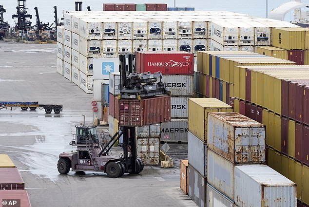 Dock workers return to work in Port Miami on Friday after the union representing 45,000 striking U.S. longshoremen at East and Gulf Coast ports reached an agreement to suspend a three-day strike