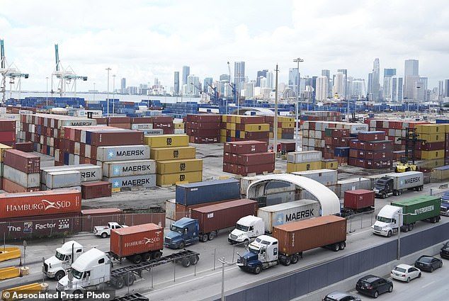 Trucks line up to enter Port Miami after the union representing 45,000 striking dock workers reached an agreement to suspend a three-day strike