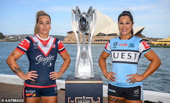 Sydney Roosters captain Isabelle Kelly and Cronulla Sharks captain Tiana Penitani pose for a photo ahead of a 2024 NRLW Grand Final press conference at Circular Quay, Sydney, Friday, October 4, 2024. The Sydney Roosters take on the Cronulla Sharks in the Sunday's NRLW 2024 Grand Final. (AAP Image/Dan Himbrechts) NO ARCHIVING