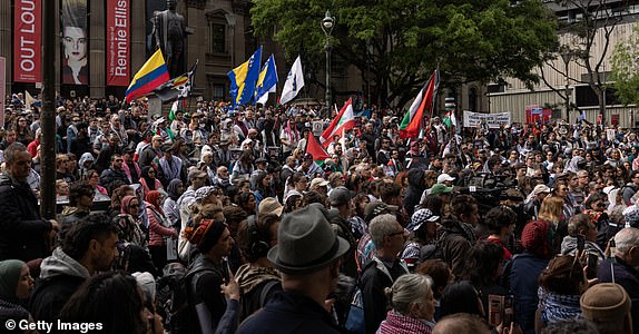 MELBOURNE, AUSTRALIA - OCTOBER 06: Pro-Palestinian supporters gather at the State Library of Victoria for an organized protest to commemorate the anniversary of the war on Gaza on October 6, 2024 in Melbourne, Australia. Organizers of pro-Palestinian protests in Sydney will go ahead with a rally on Sunday, October 6, despite legal attempts by police to ban the gatherings due to security concerns related to the expected crowd size and potential disruptions. A vigil is planned for the next day to honor the victims of the violence in Gaza, to coincide with the one-year anniversary of the Hamas attacks, which have drawn criticism from government officials who say the timing "extremely provocative". Protesters also planned to gather for similar events in Melbourne. (Photo by Diego Fedele/Getty Images)