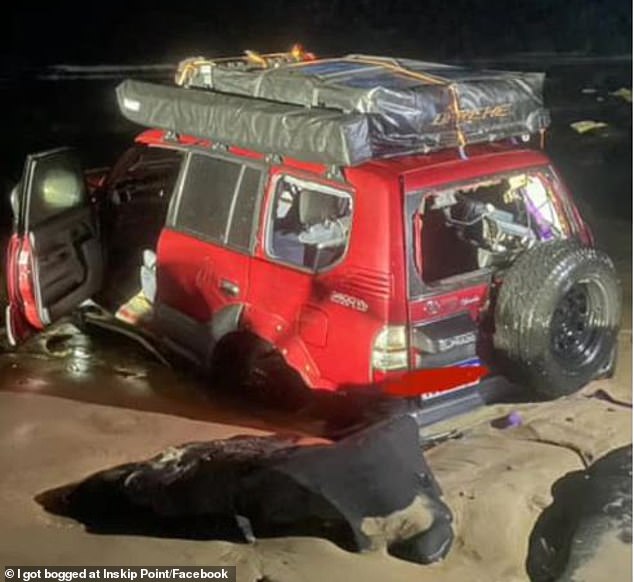 The vehicles were pushed against the rocks and sank in the sand. No one was injured (photo the red 4WD)