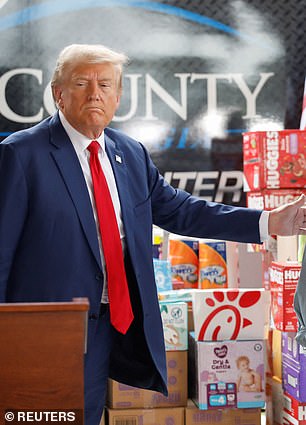 Republican presidential candidate and former US President Donald Trump spoke to the press about the impact of Hurricane Helene in Evans, Georgia