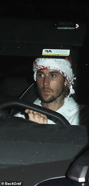 The 30-year-old pop star wore a red and white scarf around his head, which some fans identified as a keffiyeh, along with a heather gray hooded sweatshirt.