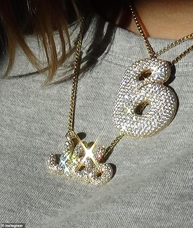 Justin's model wife, 27, recently showed off a diamond-encrusted necklace with their newborn baby's initials