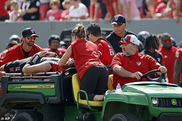 The quarterback had to be carted off the field after the collision left him motionless