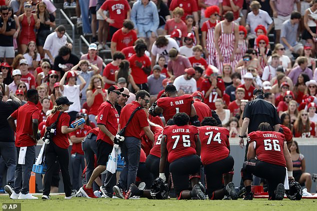 McCall's teammates took a knee as the crowd in Raleigh fell silent on Saturday