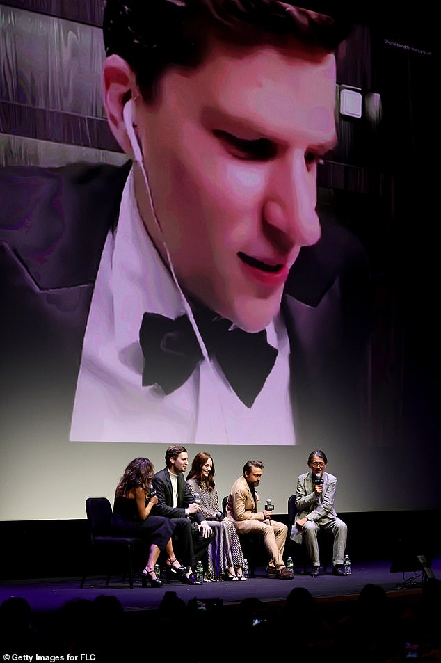 The group behind A Real Pain were all talking to each other as Eisenberg joined them on screen, wearing a tuxedo and wired headphones.