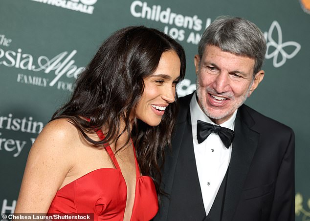 Meghan laughs with Mr. Viviano, CHLA president, at the children's gala on Saturday evening