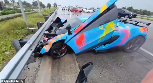 The custom-built McLaren 570S skidded along the wet Miami highway before crashing into the metal barrier along the road, tearing off the hood and destroying the entire front half of the car.