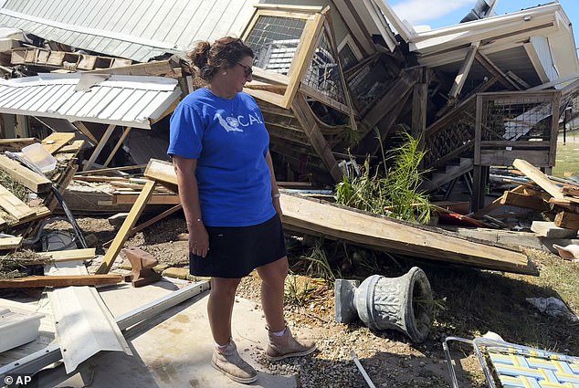 Laurie Lilliott stands amid the wreckage of her destroyed home in Dekle Beach in rural Taylor County, Florida, in the aftermath of Hurricane Helene.