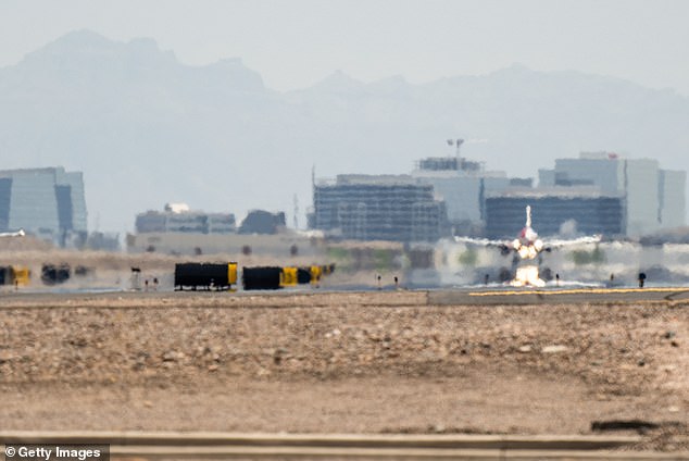 A plane lands at Phoenix Sky Harbor International Airport during a heat wave in July 2023 in Phoenix, Arizona.