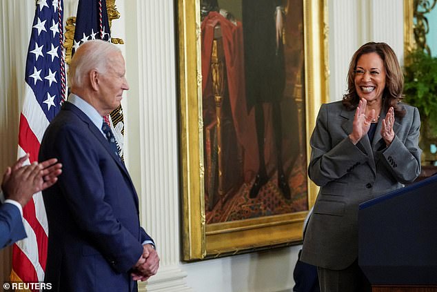 Democratic presidential candidate Vice President Kamala Harris applauds US President Joe Biden