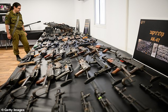 An array of AK-47s can be seen on the display set up by the IDF