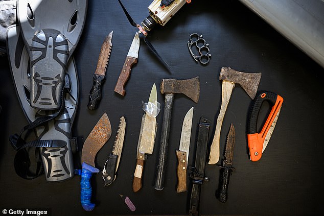 Recovered knives and blades used by Hamas members during the October 7 attacks are on display at an IDF exhibition