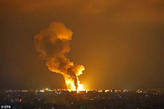 Smoke rises from a fire after an explosion following an Israeli attack in Beirut, Lebanon, early October 6