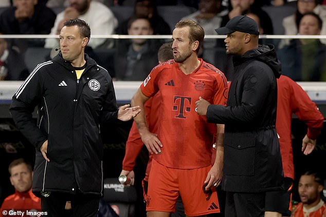 Kane spoke to Bayern boss Vincent Kompany (right) as he left the match with around 20 minutes remaining