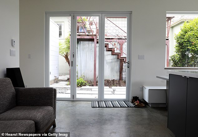 Pictured: the exterior of the cottage, complete with a living room and kitchen