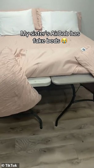 Only to reveal that it's just two folding tables under a blanket