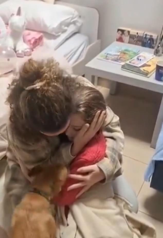 Images also show the little girl being hugged and comforted by her half-sister Natali