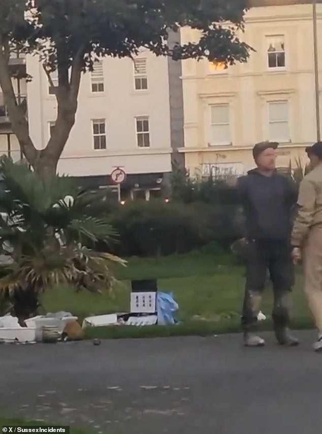 A passerby then positioned himself between the man and the tribute before telling him to go