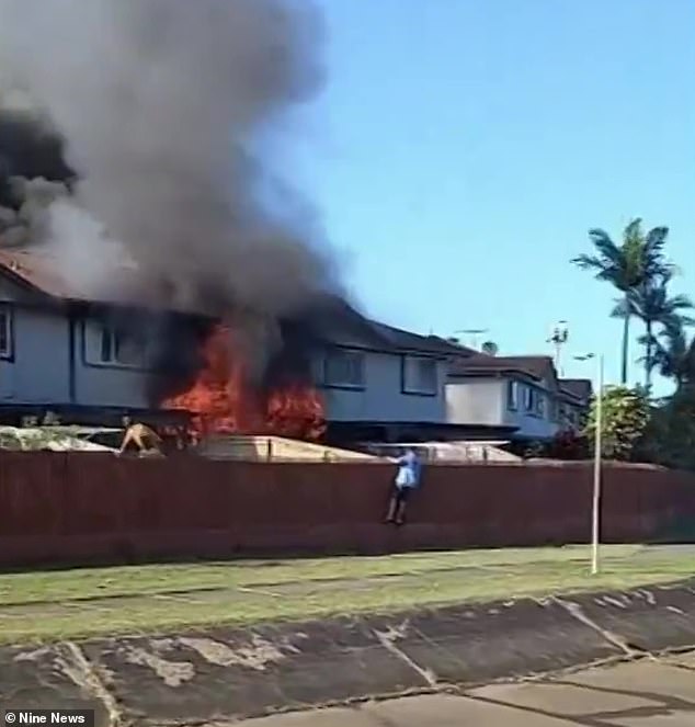 Firefighters managed to extinguish the fire (pictured) around 8am, but the searches were postponed after the roof of the house collapsed.