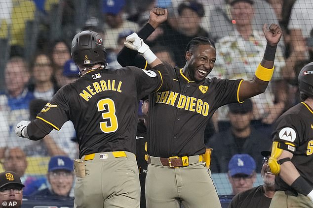 The San Diego star celebrates after Jackson Merrill extends their lead after the delay