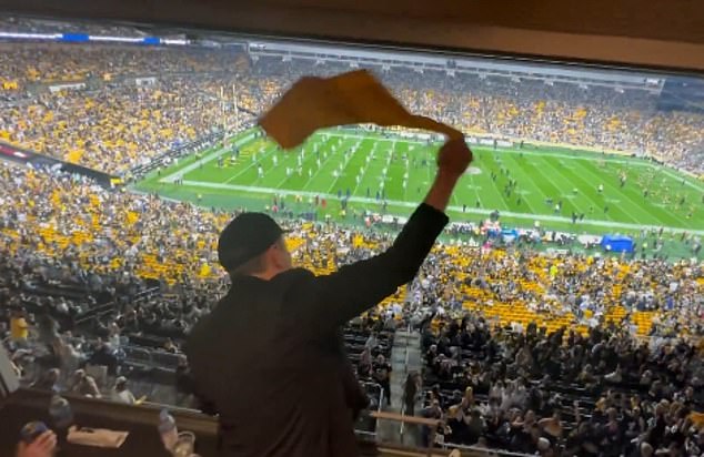 Musk then appeared from a luxury suite at the Steelers-Cowboys game on Sunday evening