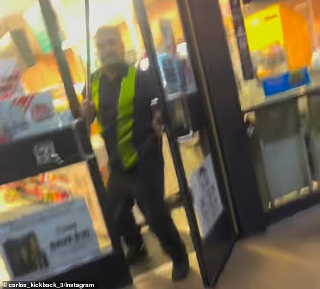 The store clerk held up a broomstick to shoo the teens away