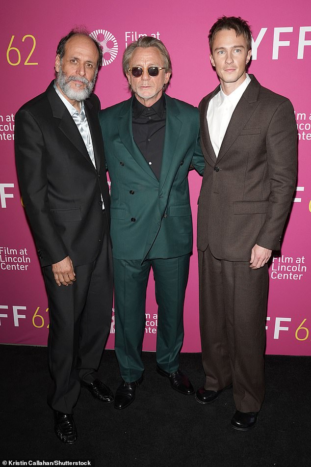 The actor cut a chic figure in a double-breasted suit as he posed alongside his co-star, Drew Starkey, 30, (right) and director Luca Guadagnino, 53 (left)