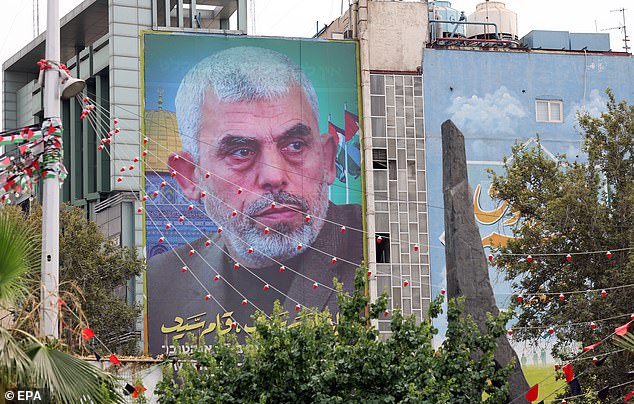 A billboard of new Hamas leader Yahya Al-Sinwar hanging on a wall in Palestine Square in Tehran, Iran, August 12, 2024