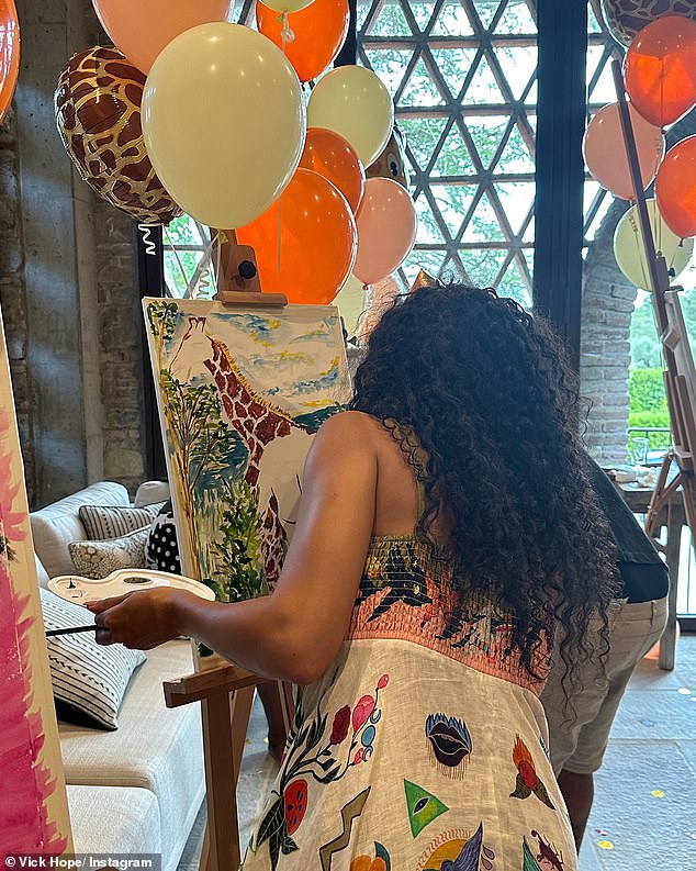 Continuing her love of giraffes, Vick also enjoyed a painting session, with the talented star creating a masterpiece starring the animal.