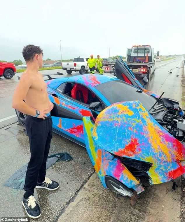 Doherty is seen next to his McLaren after the crash